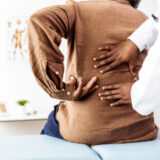 Image of woman at doctors office for back pain